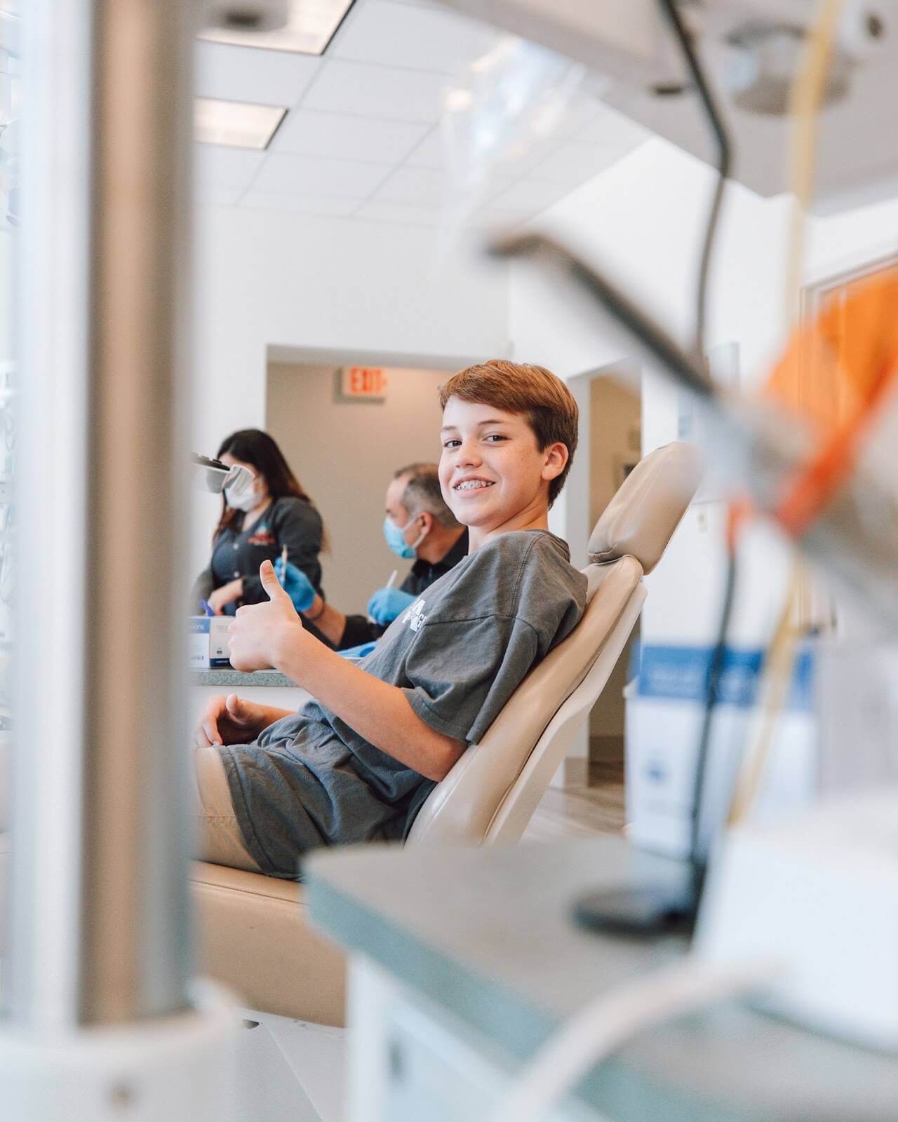 Kid smiling in dentist chair