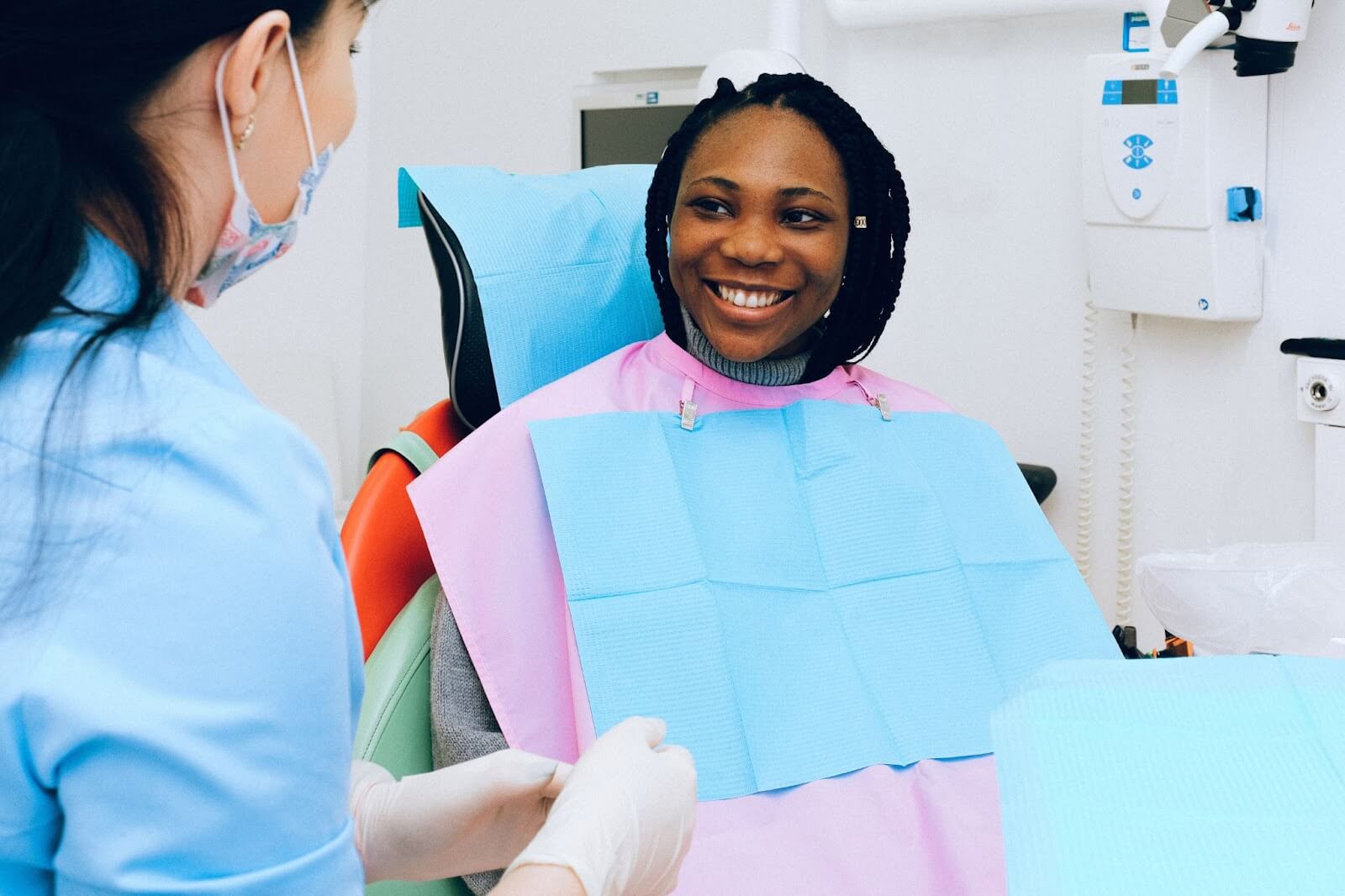 Young patient listening to how their smile will change as they age